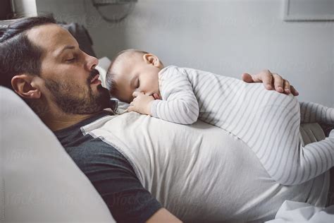 Baby Sleeping On Father S Chest By Stocksy Contributor Lumina Stocksy