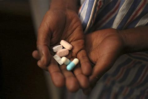 Print Nine Year Old Tumelo Shows Off Antiretroviral Arv Pills Before