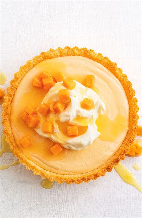 This tropical dessert is packed with passion fruit, papaya and lime and can be prepared in just 10 minutes. Papaya and coconut tart with ginger syrup | Papaya recipes dessert, Desserts, Coconut desserts