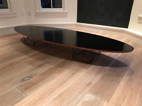 On account of its elliptical shape, it quickly acquired the nickname 'surfboard table'. Eames "Surfboard" Cocktail Table with Elliptical Rod Base ...