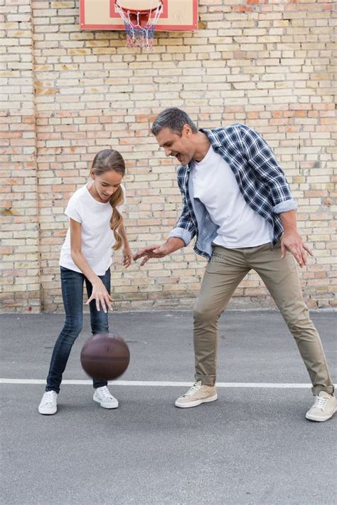 father and daughter playing basketball stock image image of playing ball 100720671