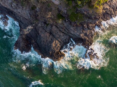 Free Photo Vertical Aerial Shot Of Sea Waves Hitting The Cliff