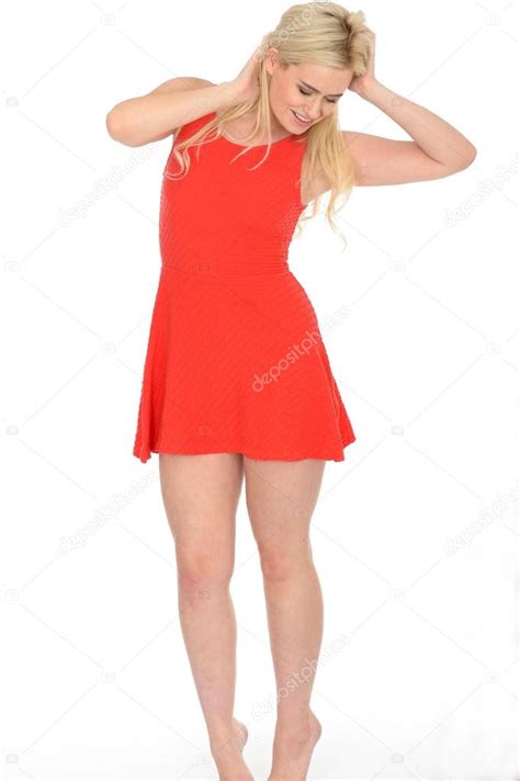 Attractive Sexy Young Blonde Haired Woman Wearing A Short Red Mini