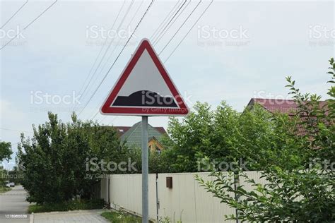 Triangular Road Sign Speed Bump On A Metal Pillar Stock Photo