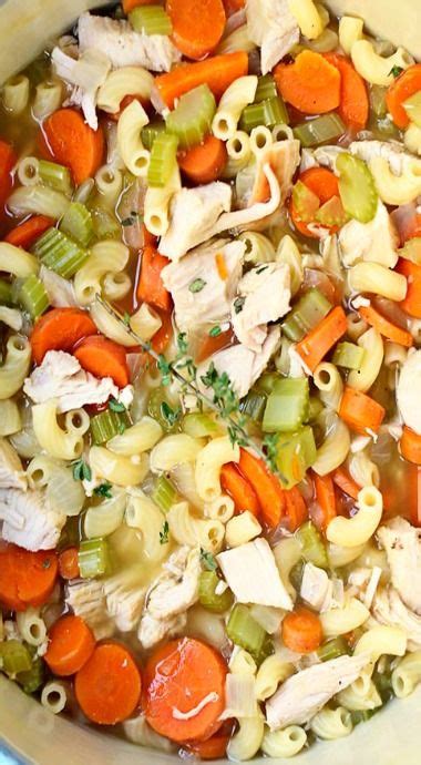 A Bowl Filled With Pasta Carrots And Chicken