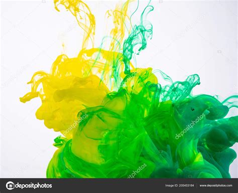 Yellow And Green Paint Make An Abstract Acrylic Cloud In Liquid Two