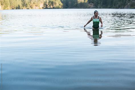 Portrait Of Smiling Active Woman After Swimming In A Lake By Stocksy