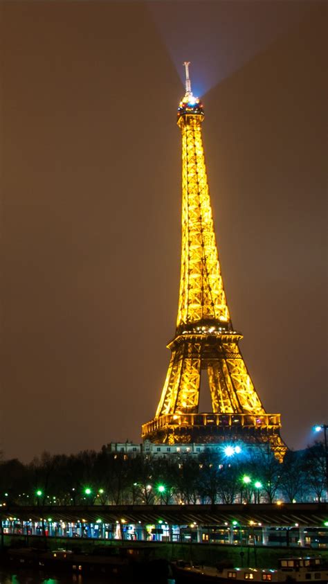 Paris Eiffel Tower With Yellow Lighting With Brown Sky Background 4k Hd