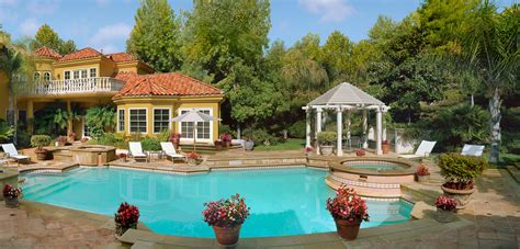 Stock Photo Night View Of A Residential Mansion Backyard With A Pool