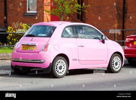 A Pink Fiat 500 Car That Does Up To 70 To The Gallon Parked In Carlisle