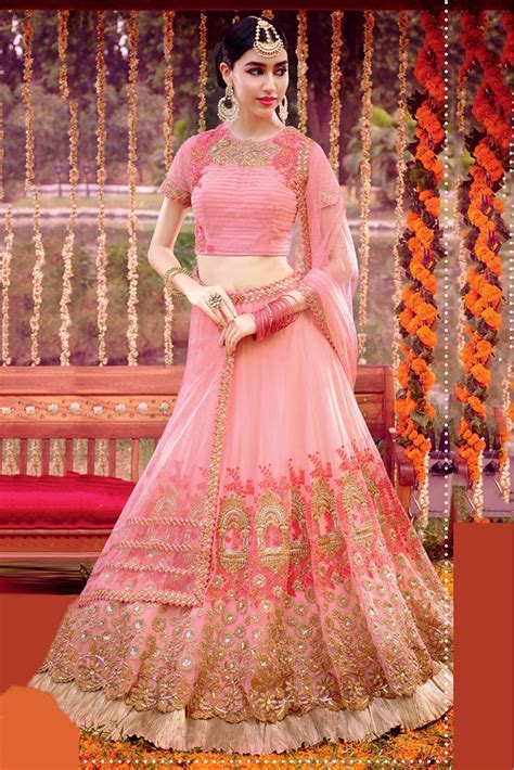 We love this modern design with the scallop print on the blouse and colourful mirror on the skirt. Net Semi Stitched Lehenga Choli In Baby Pink Colour ...