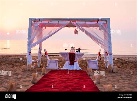 Cabana And Romantic Dinner Setting On A Beach At Sunset Stock Photo Alamy
