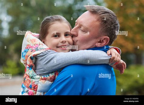 Giving His Daughter A Kiss Stock Photo Alamy