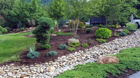 Landscaping with a dry stream and using river rock to accent your garden. Top 50 Best River Rock Landscaping Ideas - Hardscape Designs