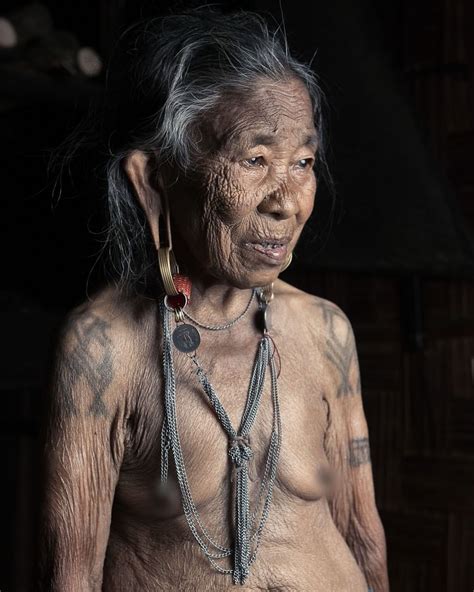 A Tribal Old Woman From Nagaland Belonging To Konyak Tribe Covers With