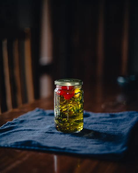 The strength of the infusion depends upon the amount of acidified herb or garlic used and the temperature of the oil. Infused Olive Oil (Thyme + Sage + Chili + Garlic) · alanabread