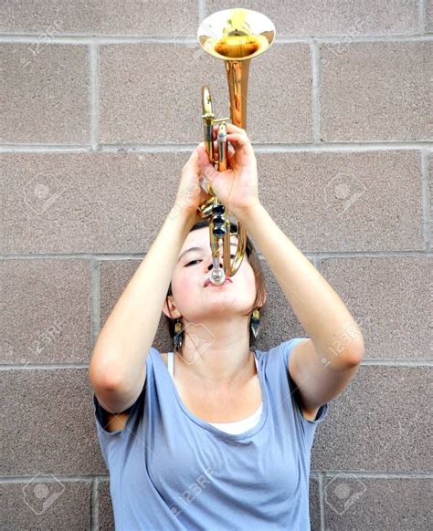 Female Trumpet Player Blowing Her Horn Stock Photo Picture And