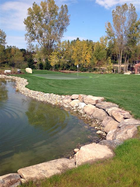 Field Boulder Retaining Wall Separating The Private Home Golf Course From The Man Made Pond