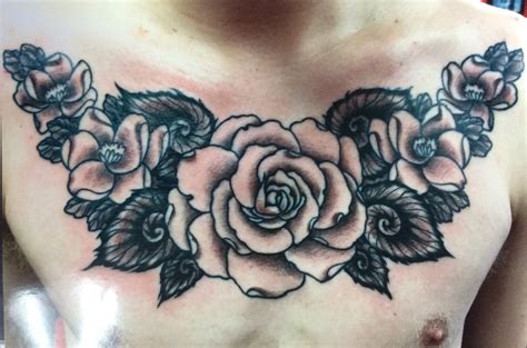 Red rose tattoos for men are quite popular and for this man, the vivid attention to details shows just how powerful his connection to this flower may be. Roses Chest | Chad Stewart Tattoo