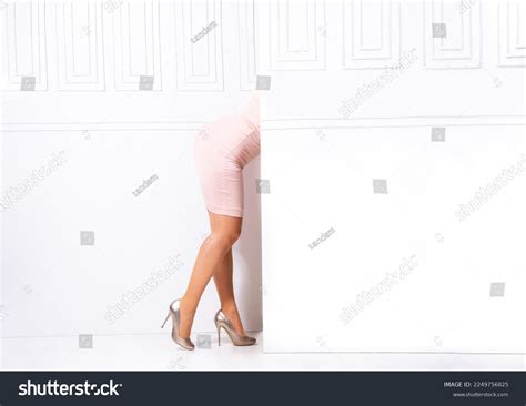 Womans Legs Hidden Behind White Wall Stock Photo Shutterstock