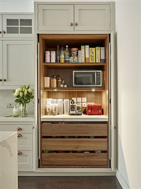 Our small, messy kitchen pantry got a major makeover, and now the space is super organized and efficient. Breakfast / pantry cabinet with shelf lighting, power ...