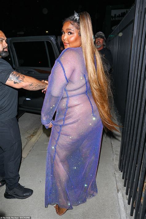 Lizzo Leaves Little To The Imagination In A See Through Purple Gown And Pasties As She Arrives