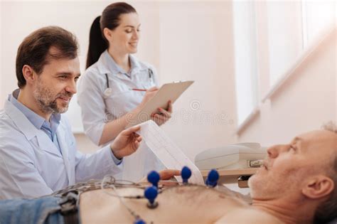 Prominent Medical Worker Assisting Her Colleague Stock Photo Image Of