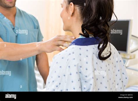 Nurse Examining Patients Neck Before Ultrasound Test Stock Photo Alamy