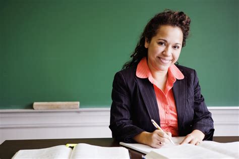 Teacher Writing Smiling Portrait Teachstone