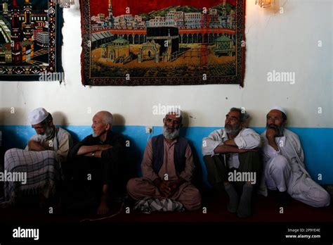 Afghan Sufis, traditional practitioners, meditate while celebrating the