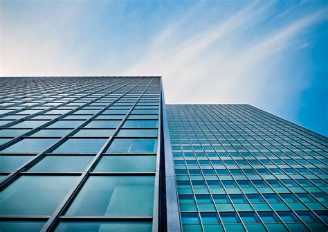 Low Angle View Of Office Building Against Blue Sky · Free