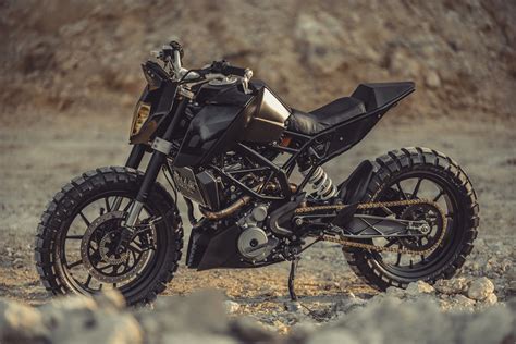 The ktm 390 duke is a tiny bike, there is no arguing that, but surprisingly it is not at all cramped, with an 830mm seat height and tight but comfy 'bar reach, the extremely narrow nakedbike feels like a mini streetfighter and it feels fun before you even start the engine. KTM Duke 390 Tracker by Revolt Cycles - BikeBound