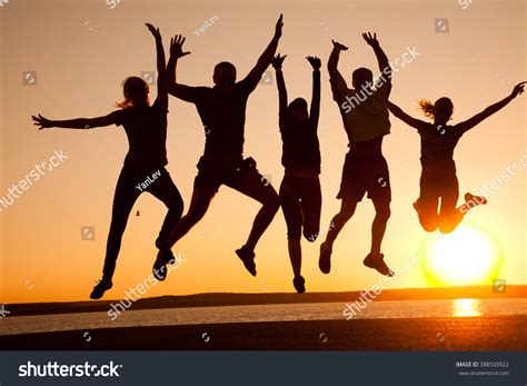 Group Happy Young People Jumping Beach Stock Photo Edit Now 388503922
