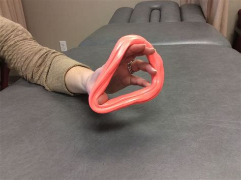 Photo Of Finger Extension With Therapy Putty Therapy Putty Carpal Tunnel Hand Strengthening