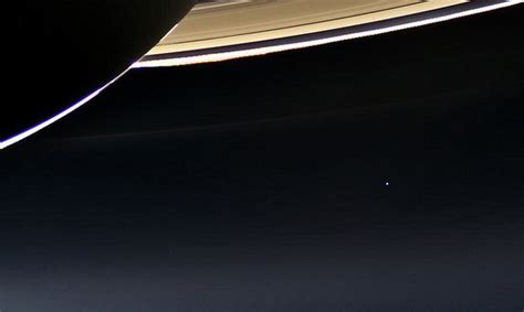 Cassini Snaps New Photographs Showing Earth Next To Saturns Rings