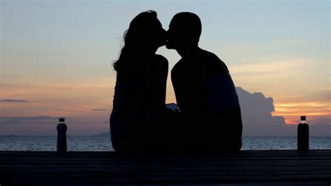 couple silhouette at the beach sunset light stock footage video 3600356 shutterstock