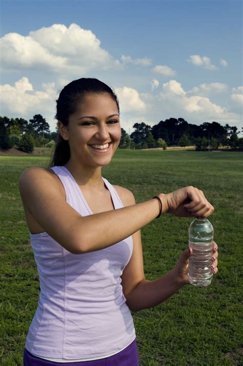 Exercise Women Free Stock Photo A Young Woman Drinking Bottled