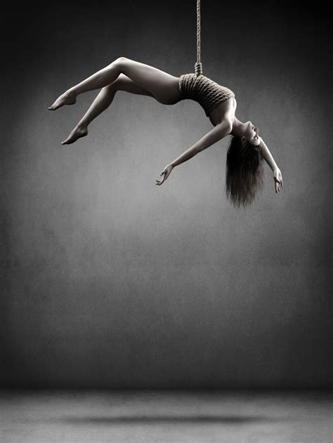 woman hanging on a rope photography by johan swanepoel saatchi art