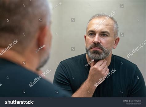 Middleaged Handsome Man Looking Mirror Bathroom Stock Photo 2079952636