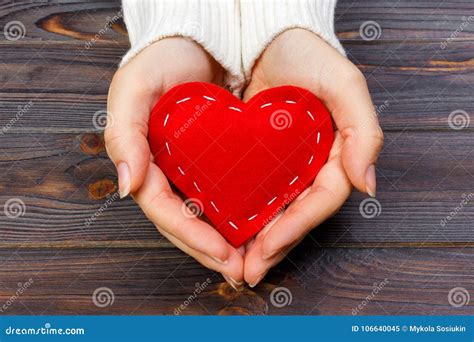 A Woman Holds A Red Heart In Her Hands Love Concept Stock Image
