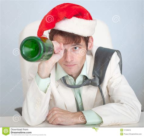 Drunk Man In Christmas Cap Plays With Bottle Stock Image Image Of Celebrating Look 11729015