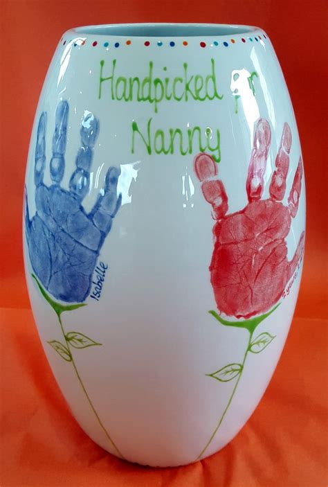 tall vase  grandchildrens handprints turned  flowers handpicked  nanny
