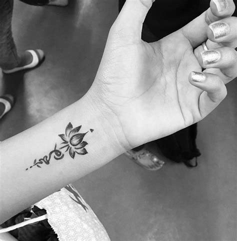 Small Simple Lotus Wrist Tattoo Ideas For Women At Wrist
