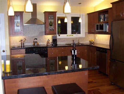 Dark cabinets don't have to be black—if the midnight mood isn't for you, consider a lighter shade of brown. Marron cohiba (antique brown) granite countertops with shaker cabinets. | Brown kitchens, Yellow ...
