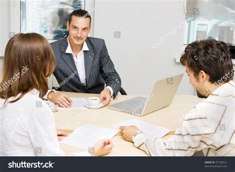 Professional Adviser Having A Discussion With A Customer Stock Photo