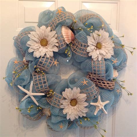 You can easily design your own. Ocean Blue Mesh Wreath with Seashells and Large Daisies ...