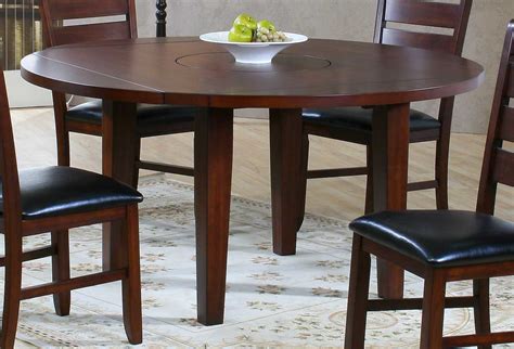 These table sets in mahogany or cherry wood lend a classy vintage touch to your dining space. Compact Dining Space Arrangement with Drop Leaf Dining ...