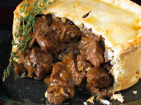 Steak and kidney pudding, a traditional british dish consisting of diced steak, onion, and kidney—generally from a lamb or pig—cooked in a brown gravy and then encased in a soft suet pastry and steamed for several hours. Gusto TV - Steak and kidney pie with dark beer | British ...