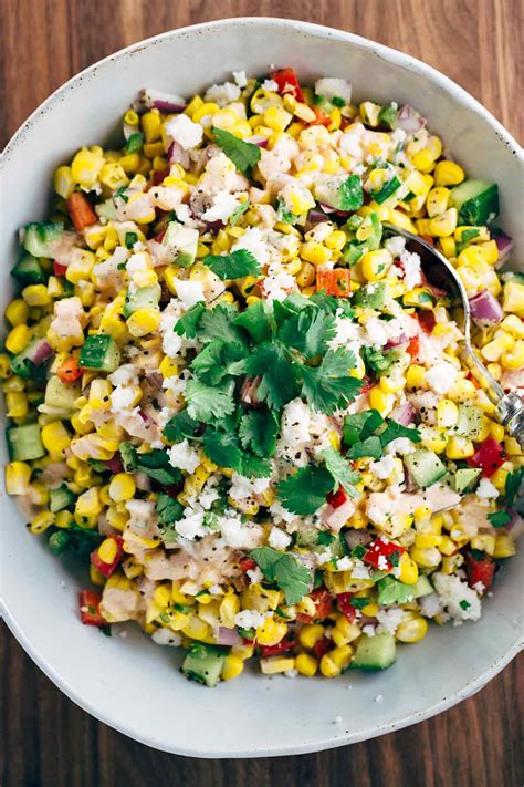 This grilled corn recipe is coated with a cooling lime crema, spiced with some chile powder, and topped with crumbled add your choice of toppings. Mexican Street Corn Salad with Chipotle Dressing | Jessica Gavin