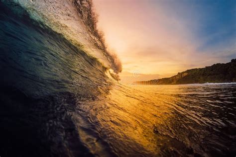 Barrel Wave Crashing In Ocean On Warm Sunset Or Sunrise Stock Image